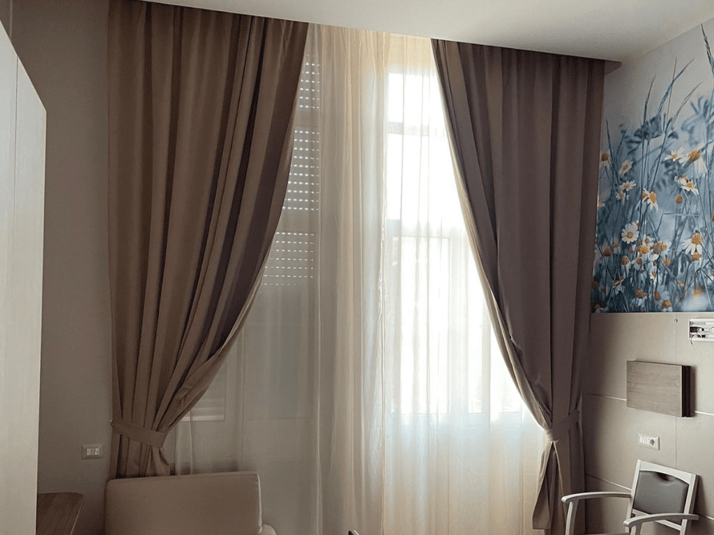 Draped curtains with rail sliding